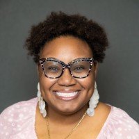 Candlelit Employee Amani Smith's profile photo