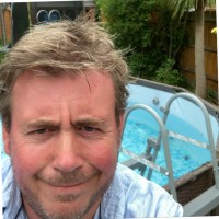 Charles Edwards Employee John Ferrier's profile photo