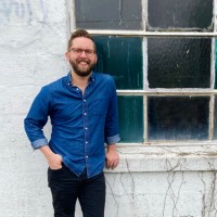 Seated Employee Jesse Baker's profile photo