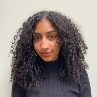 Bald. Employee Dominique Evans's profile photo