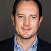 FIG. 1 Employee John McDonagh's profile photo