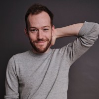 Seated Employee Alec McGuffey's profile photo